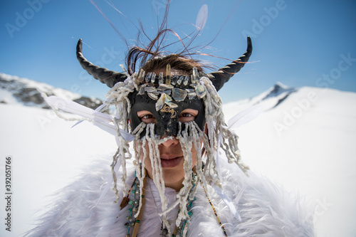 Aboriginal girl wearing face mask, dressed as mountain goat. photo