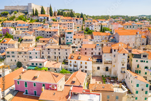 Aerial view of the old town od Sibenik in Croatia, houses on hills and old fortress of St Michael over the city