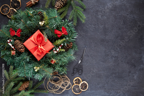Christmas wreath on black concrete background photo