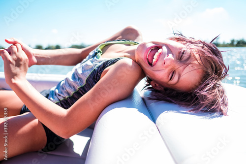 Laughing girl on a boat in hawaii