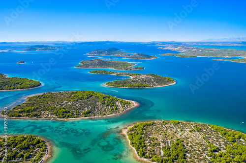 Wonderful coastline seascape, small Mediterranean stone islands in Murter archipelago, aerial view of turquoise bays from drone, Dalmatia, Croatia