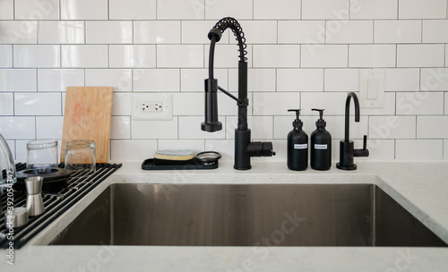 kitchen sink with white subway tiles