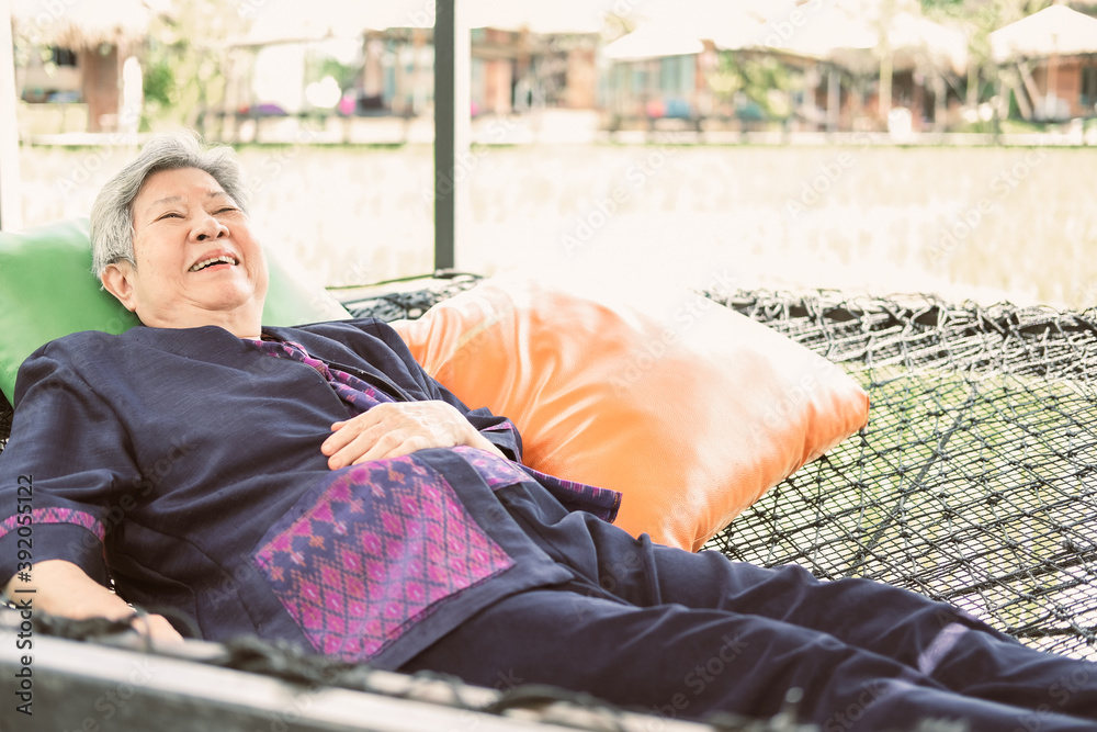 elderly woman elder lying resting relaxing outdoors. senior leisure lifestyle elderly woman elder lying resting relaxing outdoors. senior leisure lifestyle