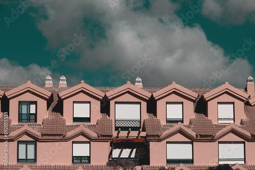 Row of terraced houses in a nice neighborhood under a dramatic sky. photo