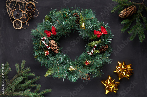 Christmas wreath on black concrete background