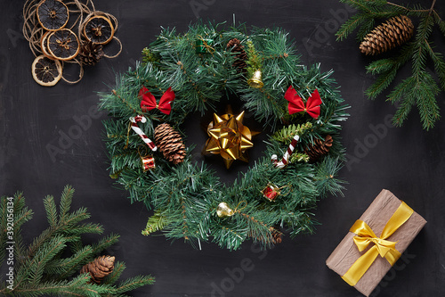 Christmas wreath on black concrete background
