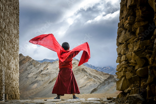 Lamayuru Monastery, Ladakh - 28 July 2019: Monk catching some fresh air. photo