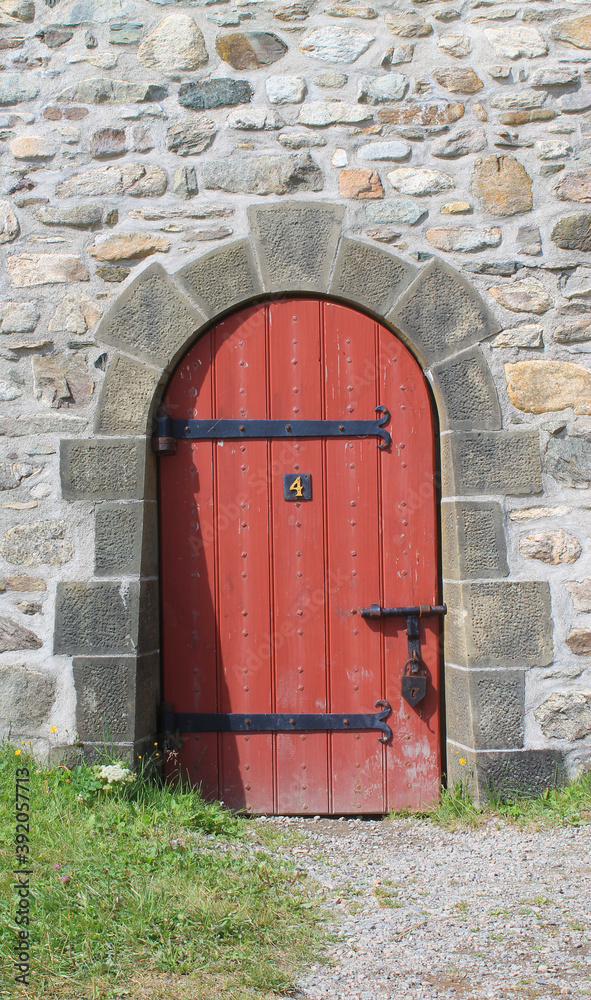 Red door in stone wall