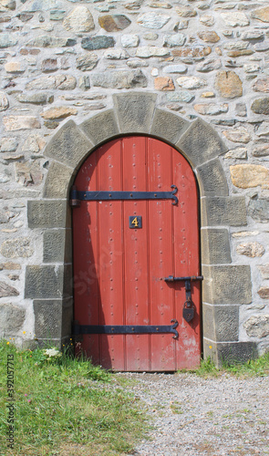 Red door in stone wall