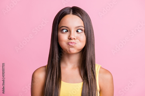 Photo of cheerful girl hold air round cheeks have fun wear yellow singlet isolated on bright color background