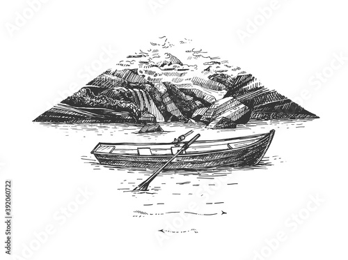 Wooden boat floating on river