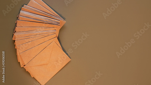 Brown craft envelopes on a gray background. Top view  flat lay