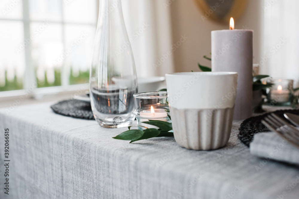 water glass and candle on a romantic dinner table for two water glass and candle on a romantic dinner table for two