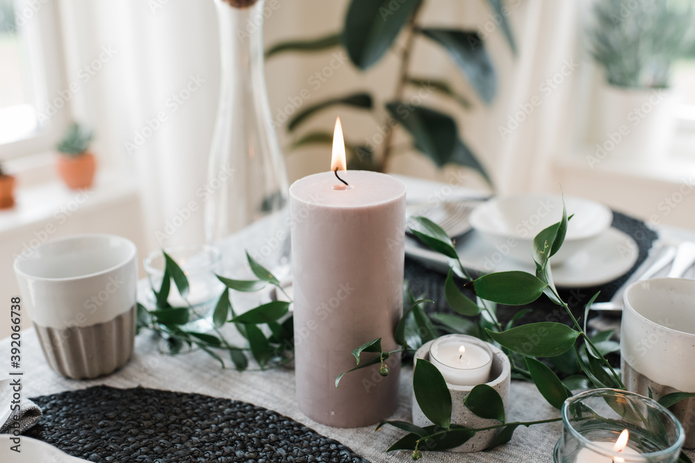 large candle on a romantic dinner table for two large candle on a romantic dinner table for two