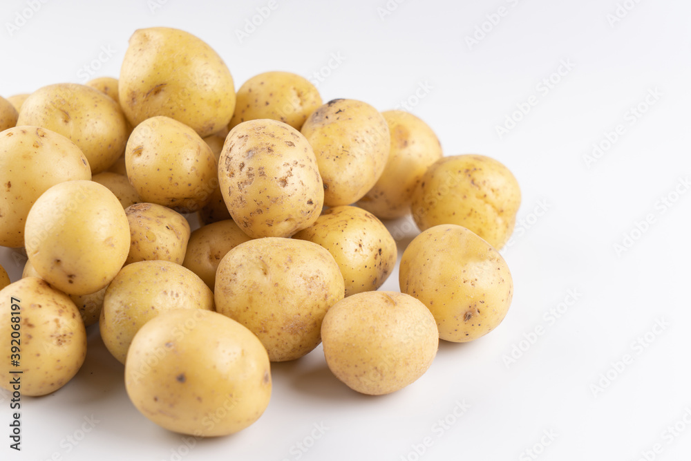 New raw potatoes isolated on white background close up New raw potatoes isolated on white background close up