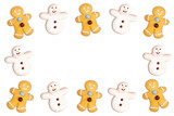 Christmas cookies frame in the shape of a snowman and a gingerbread man decorated with icing sugar and fondant on a white background