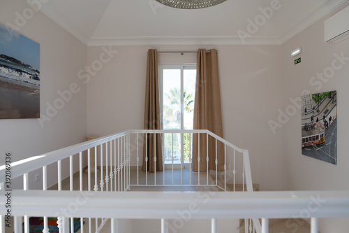 Top floor landing in a Portuguese villa showing stairs and railings