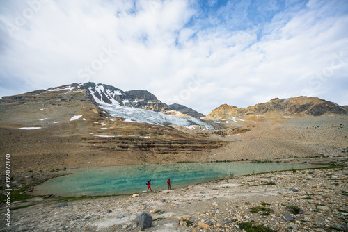 Hiking Alongside Turquoise Glacial Lake photo