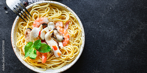 pasta spaghetti seafood shrimp, mussels, squid and more second course healthy meal snack top view copy space for text food background rustic