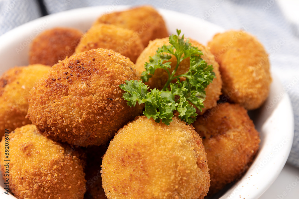 Homemade croquettes in a ceramic bowl. Typical spanish appetizer Homemade croquettes in a ceramic bowl. Typical spanish appetizer
