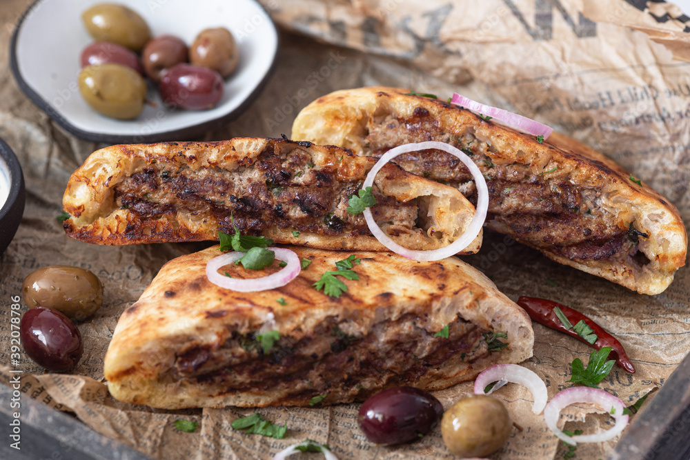 Arayes- pita bread filled with a mixture of minced meat with different spices Arayes- pita bread filled with a mixture of minced meat with different spices