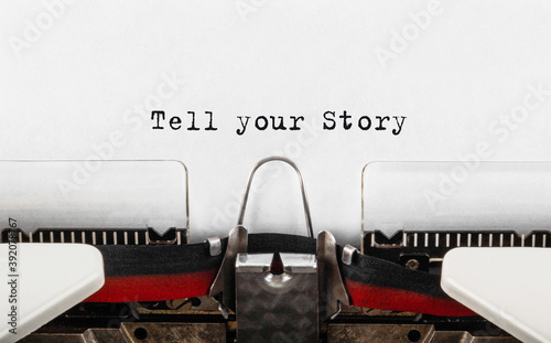 Fotografie Text Tell Your Story typed on retro typewriter