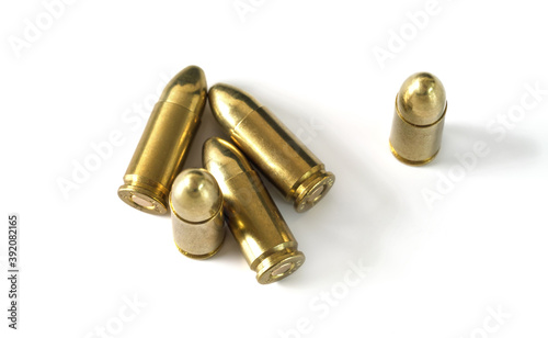 Canvas Print Yellow brass ammo bullets isolated on white background, view from above
