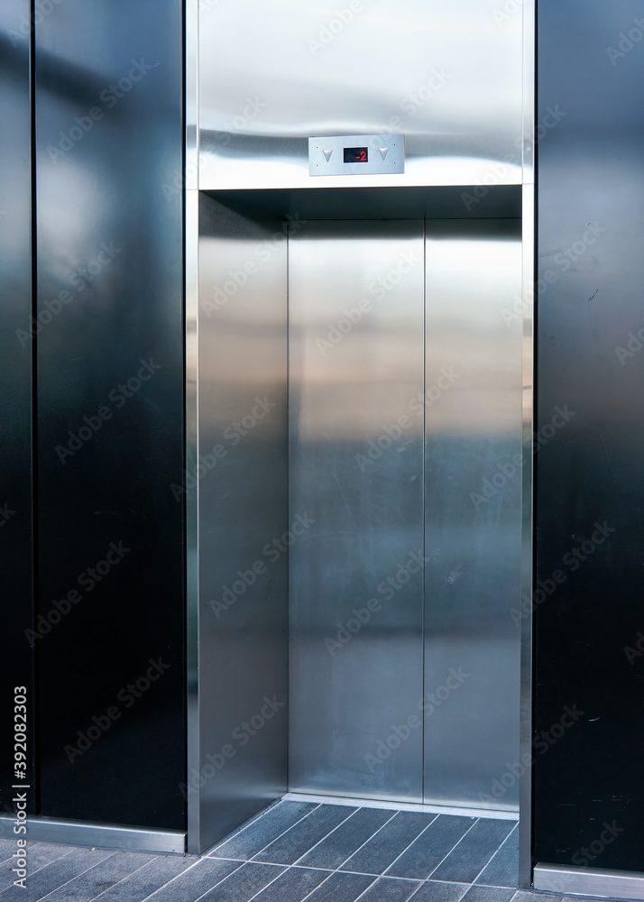 Modern steel elevator, door closed, floor showing -2