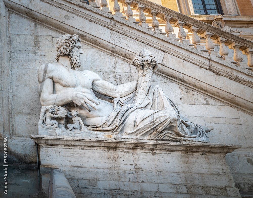 Close up of Tiber statue by Michelangelo in Campidoglio square in Rome