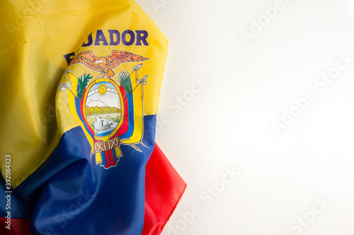 ecuadorian flag wrinkled on a white background on the left diagonal side photo