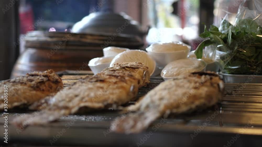 Fried fish on the grill on the street market. Fried fish on the grill on the street market.