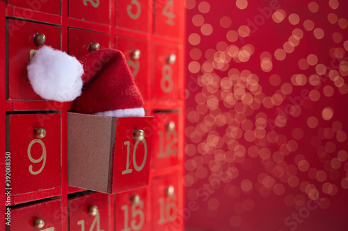 Red wooden Advent calendar with surprise for Christmas photo