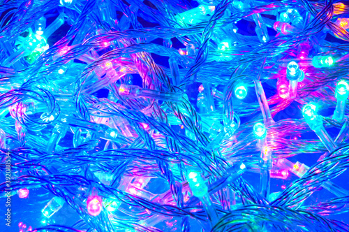 Glowing Christmas garland with multicolor lights © unclepodger