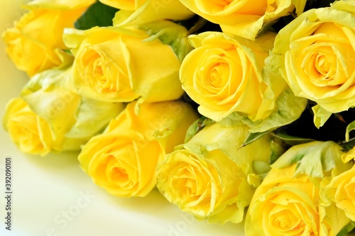 Beautiful Bouquet of fresh yellow roses with empty space  selective focus. Bunch of yellow flowers. Birthday or holiday bouquet