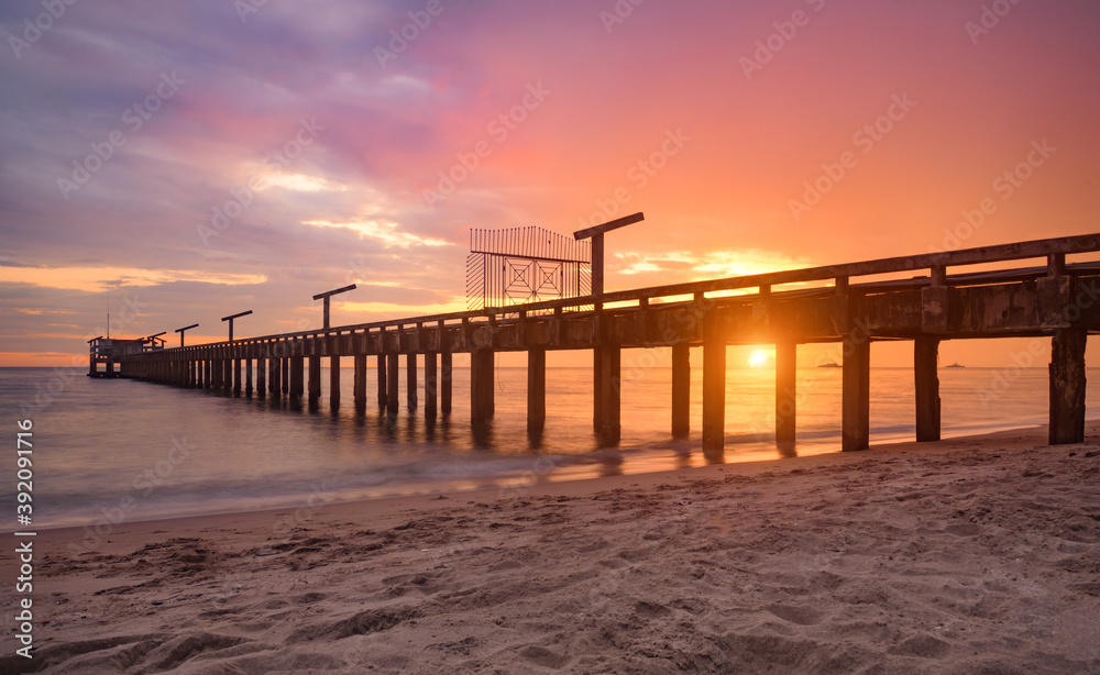 Long sea bridge in the sunset time.