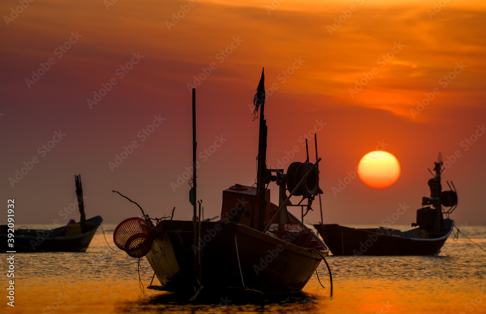 Silhouette fishery boats in the sunset time.