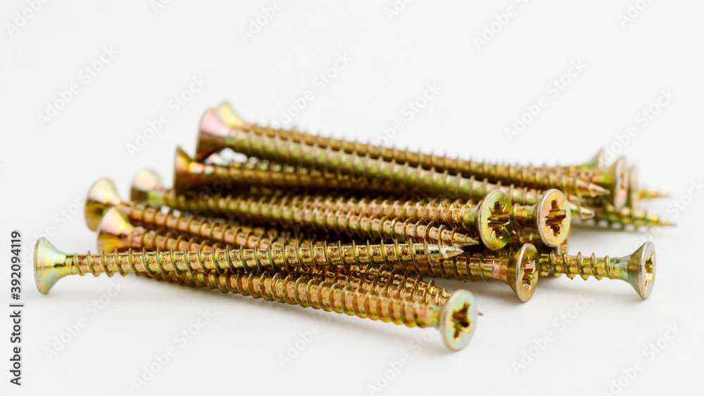 Pile of brass metal screws.