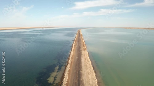 The lake with a path in the middle. photo