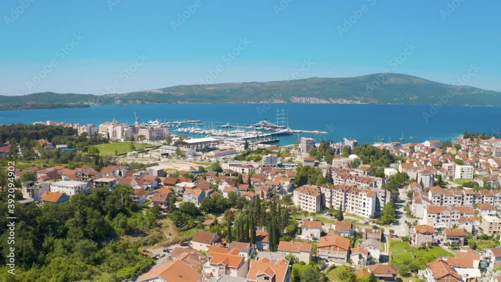Porto Montenegro, Tivat. Aerial panoramic view of the cityscape and beautiful port with yachts, surrounded by Adriatic sea Porto Montenegro, Tivat. Aerial panoramic view of the cityscape and beautiful port with yachts, surrounded by Adriatic sea