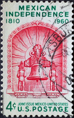 USA - Circa 1960 : a postage stamp printed in the US showing the historic bell Miguel Hidalgo brought to Mexico City from Dolores, Mexico, Text: Mexican Independence photo