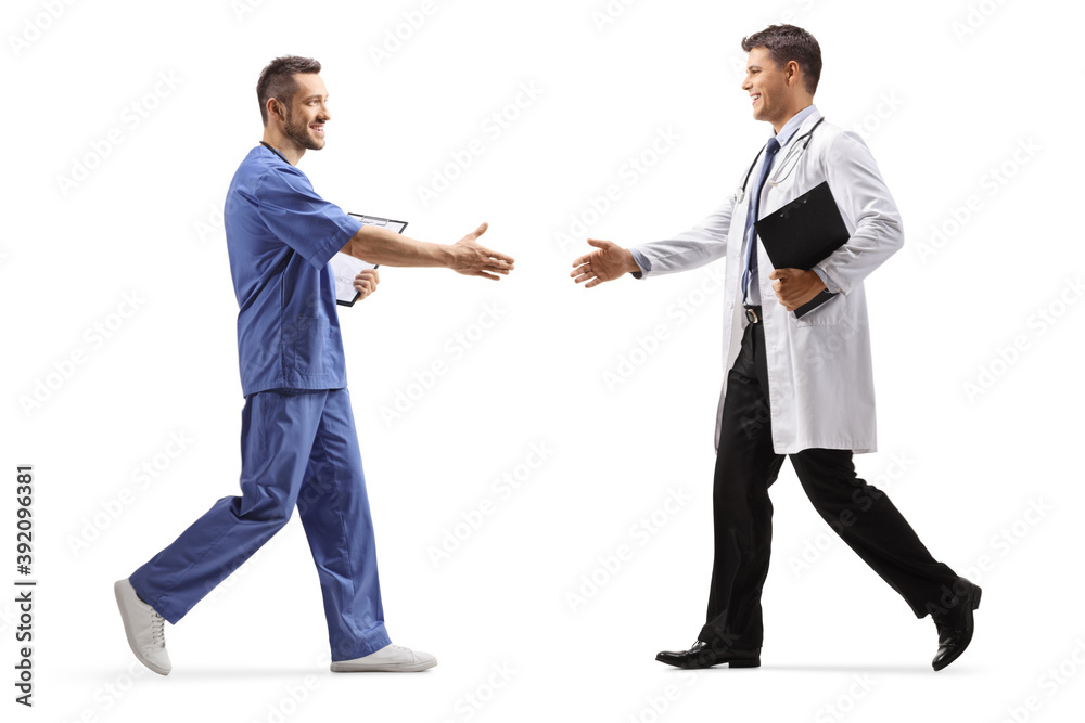 Full length profile shot of a male health worker greeting a doctor