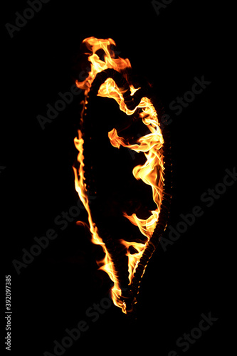 Burning heart with flames. Isolated on dark background. fire show in night. happy valentine's day card. bengal fire burning heart. space for text. wedding or valentine concept. happy new year photo