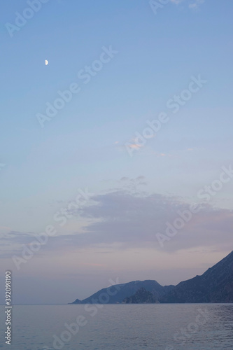 The moon rose over the calm sea and mountains © Анна Корепанова
