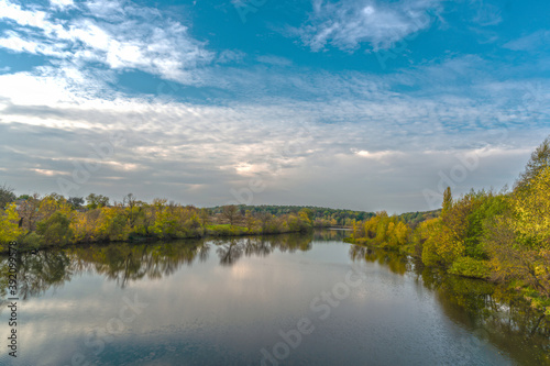 The Rostavitsya river in the Kyiv region with dense deciduous trees on both banks. Ukraine