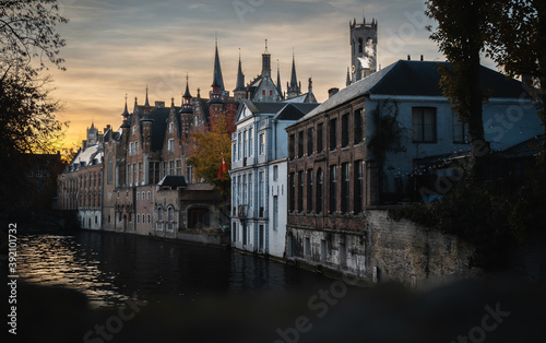 Closeup of old houses near the canals of the river Reie in Bruges photo