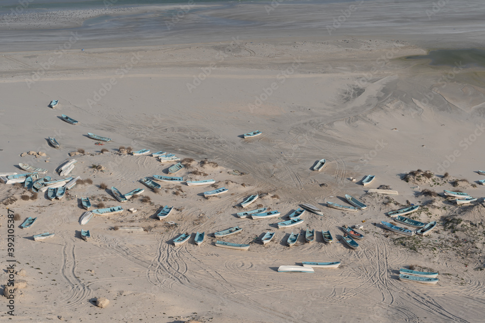 Wooden Fishing boats on the beach of Ras Madrakah in Oman Wooden Fishing boats on the beach of Ras Madrakah in Oman