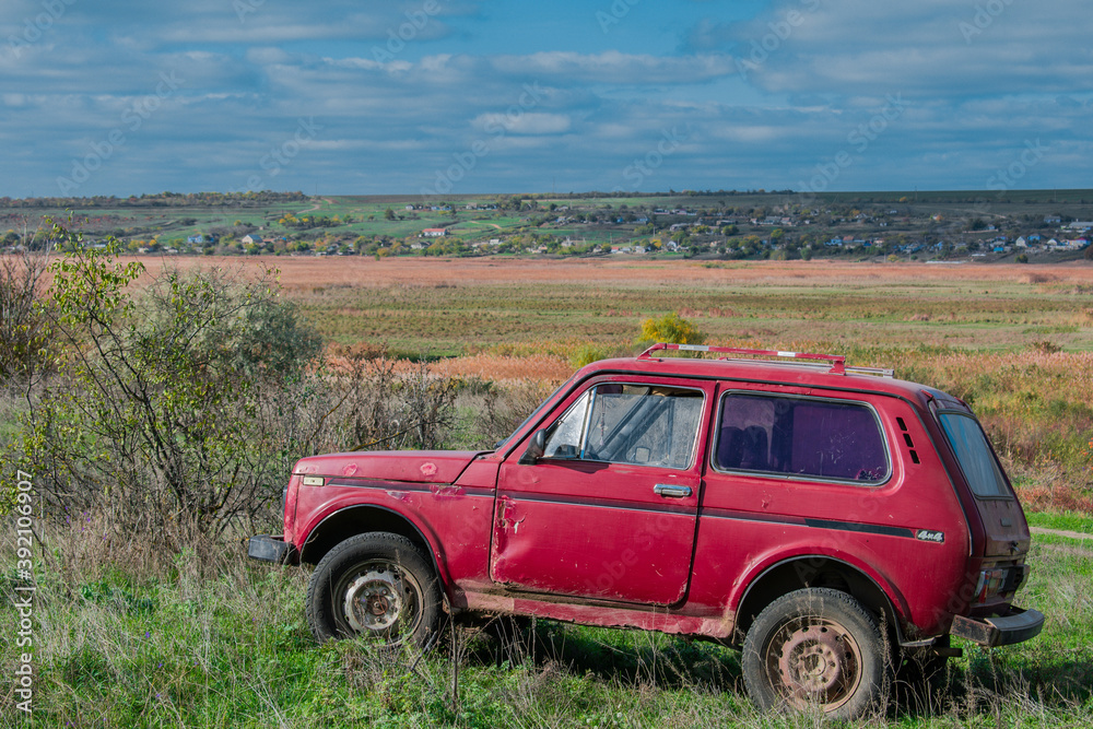 Red old car in nature. Rural landscape. Red old car in nature. Rural landscape.