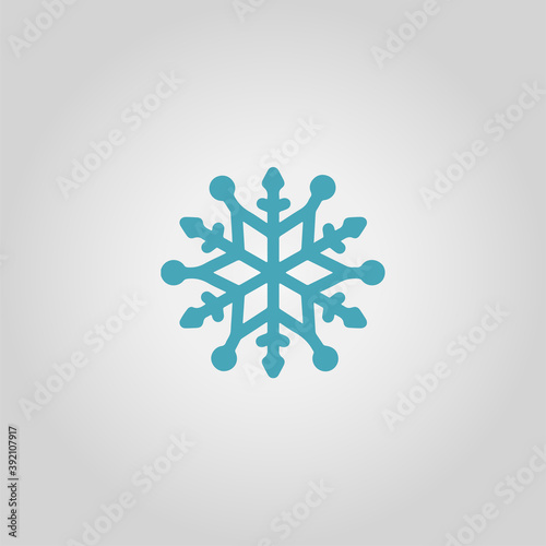 Blue snowflake silhouette on gray background