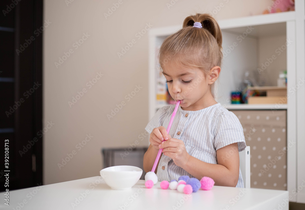 Child doing exercise fine oral motor practice, home education, easy diy activities for preschooler. Child doing exercise fine oral motor practice, home education, easy diy activities for preschooler.