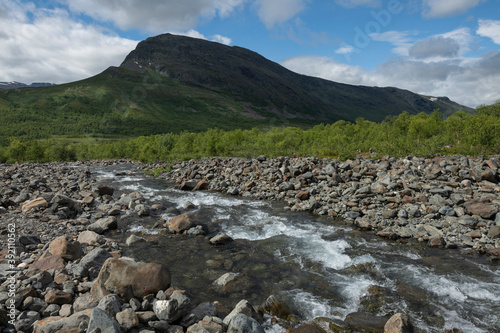 River fording along Padjelantaleden trail in Tarradalen, Sweden photo